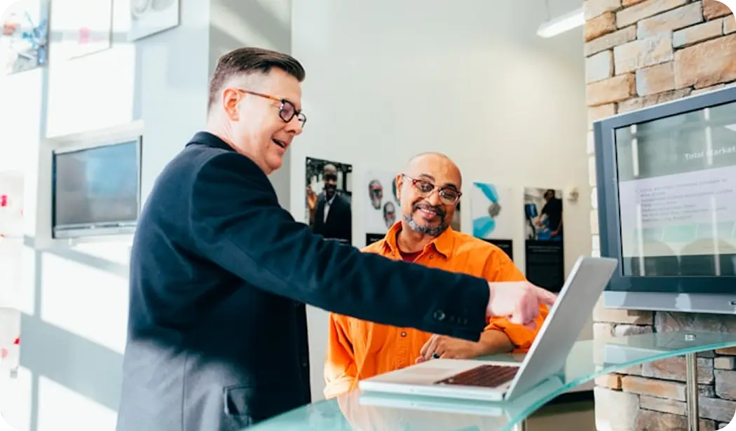 Team members meeting at a desk