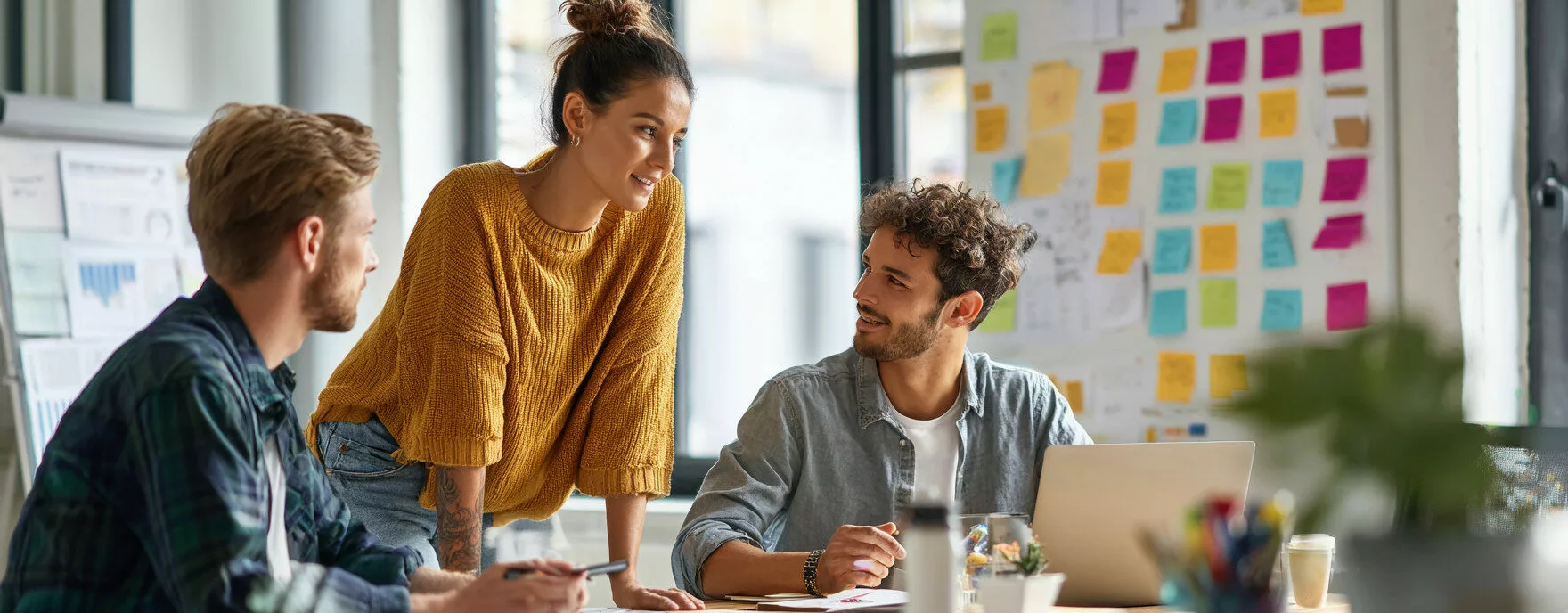 U8554719727 three creative professionals collaborating in a m b7bfb34f 6549 43f2 b9b2 5c03e28e0adf