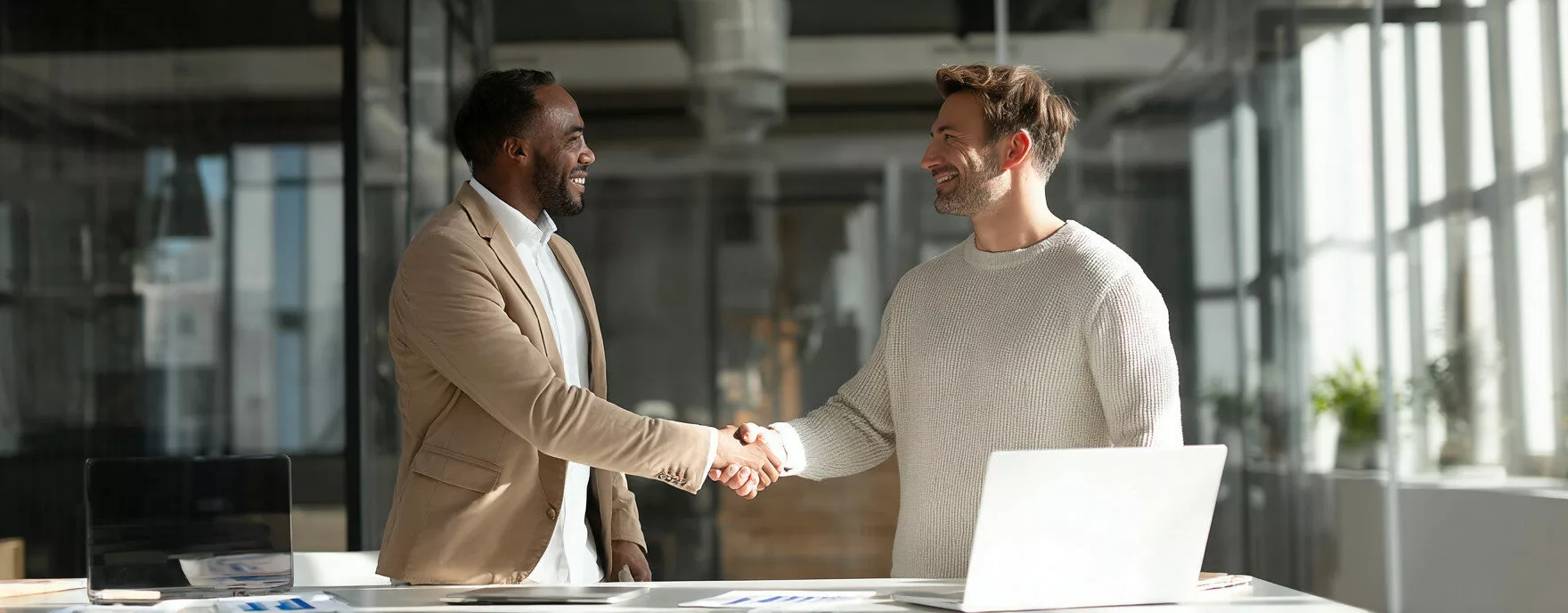 U8554719727 two professional men in a modern glass office sha 9d1899ab 9ff7 4303 a640 01f55c9d3611