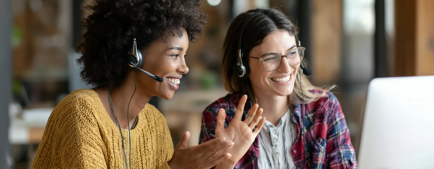 U8554719727 two professional women wearing headsets in a brig e2fdaa37 b1fa 48a6 928e 6229a34362d8